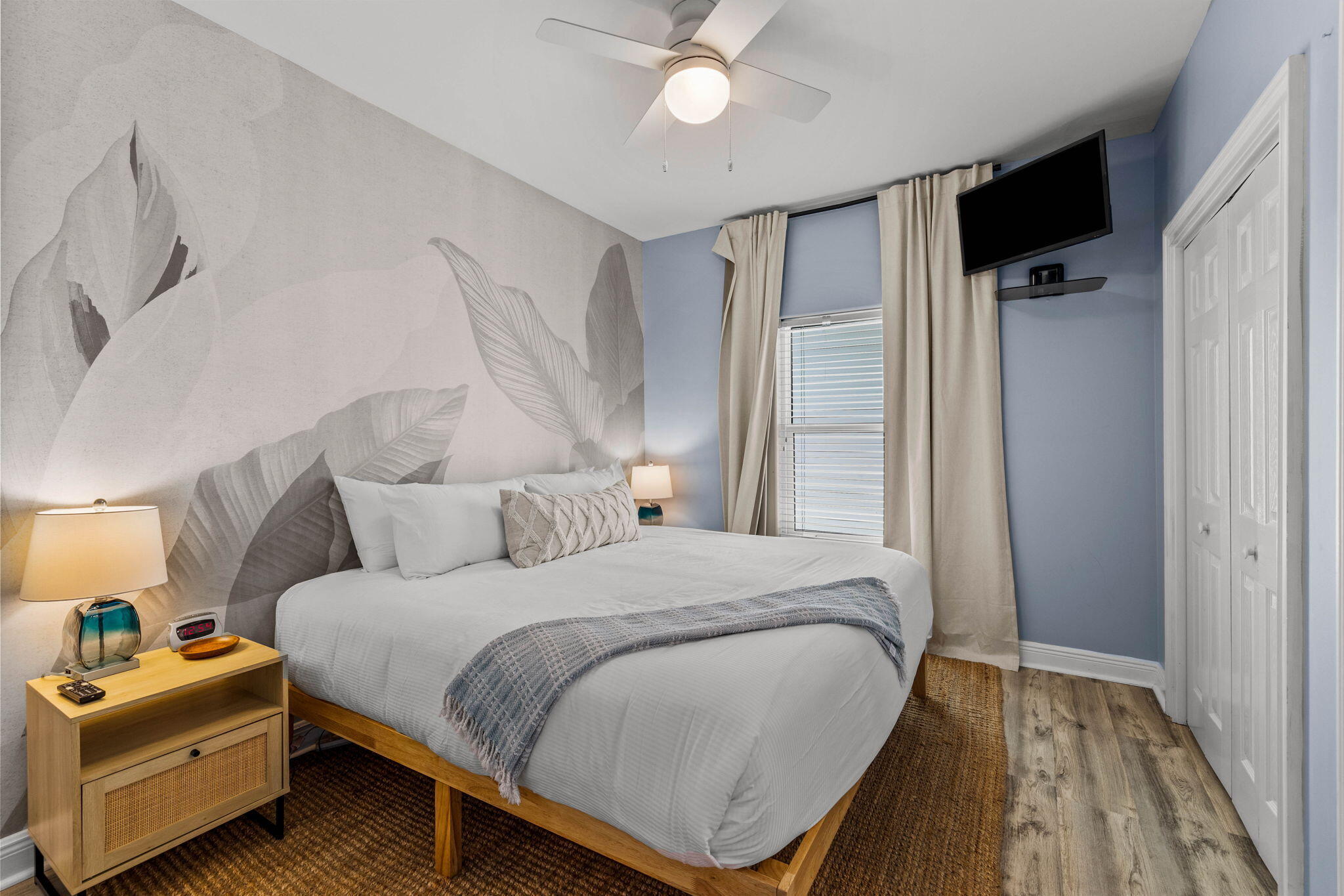 204 Sandstone Street Santa Rosa Beach, FL 32459 - Photo 60 of 80 a bedroom with a bed and a chandelier