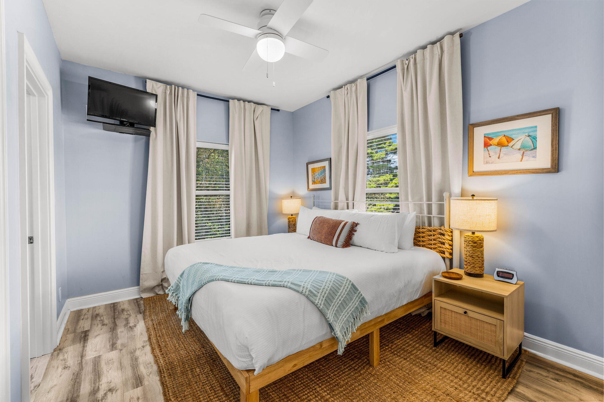 204 Sandstone Street Santa Rosa Beach, FL 32459 - Photo 66 of 80 a bedroom with a bed a flat screen tv and a window