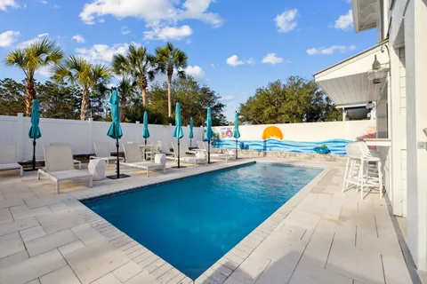 a view of a swimming pool with an outdoor seating