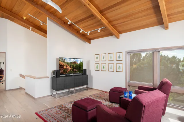 a view of a living room filled with furniture