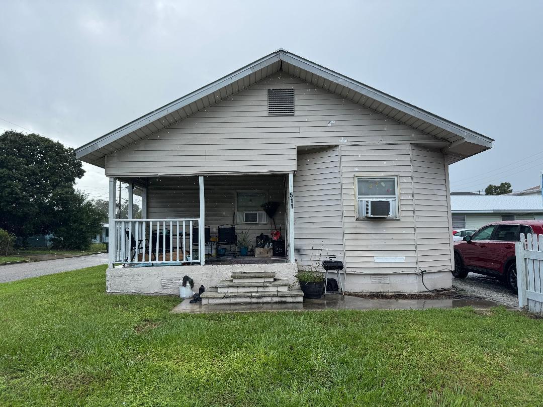 511 Texas Court Fort Pierce, FL 34950 - Photo 1 of 15 a front view of a house with a yard