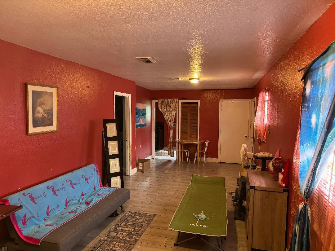 511 Texas Court Fort Pierce, FL 34950 - Photo 15 of 15 a living room with furniture and a flat screen tv