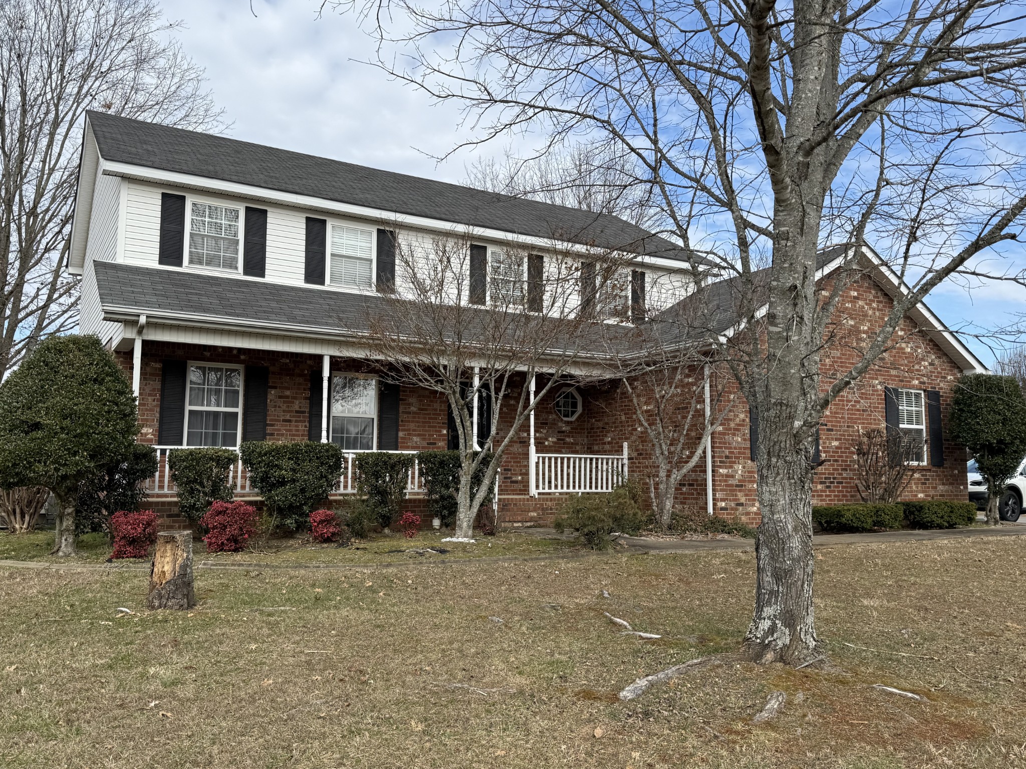 a front view of a house with garden