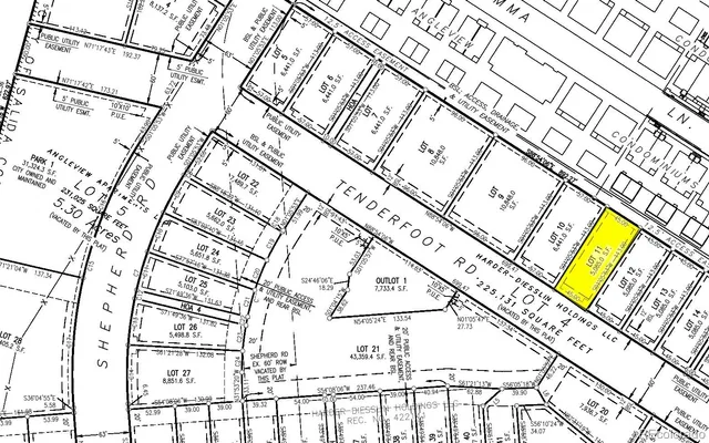 a front view of a house with parking space