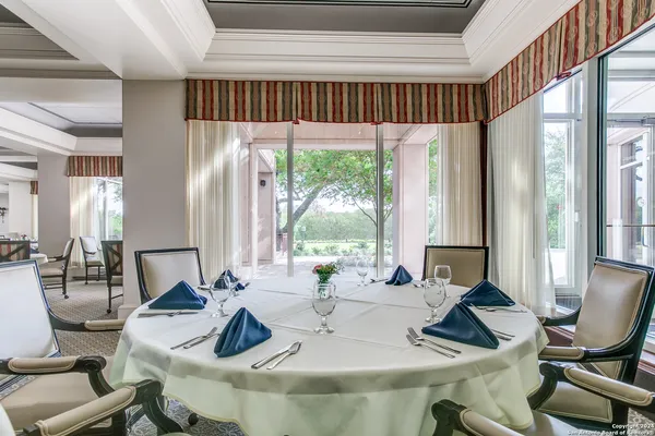 a view of a dining room with furniture window and outside view