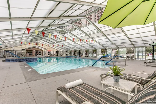 a view of a swimming pool with a patio