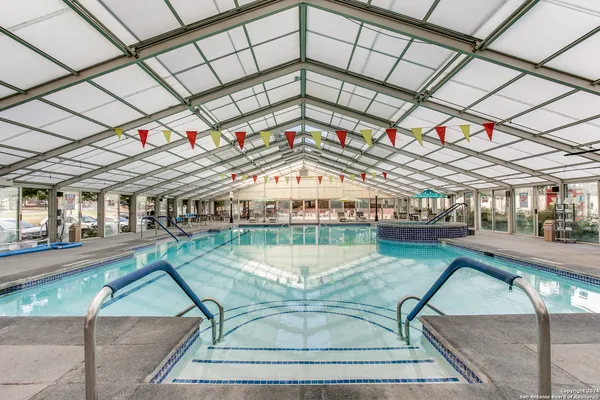 a view of a swimming pool with a patio