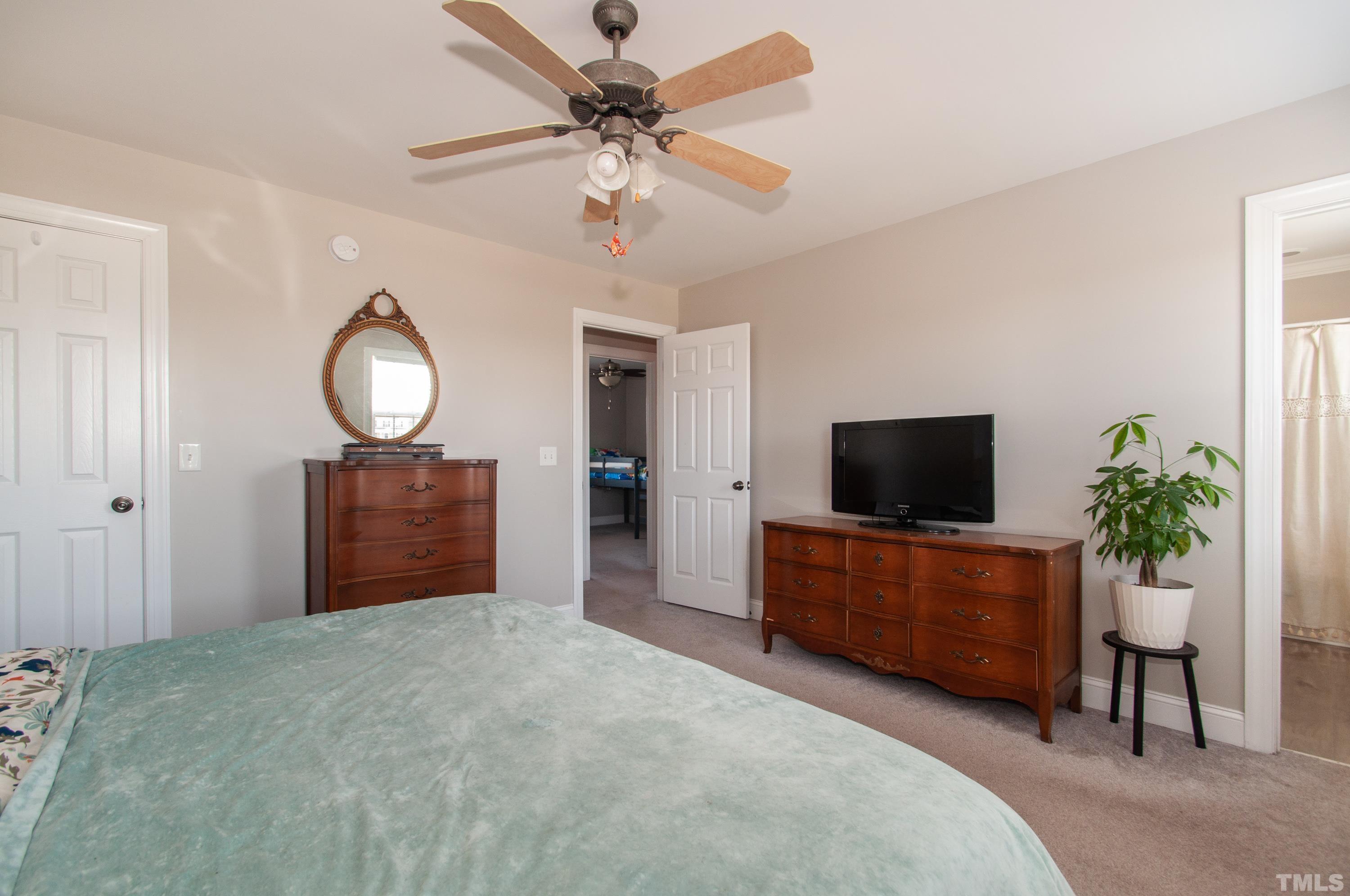 4805 Kure Road Raleigh, NC 27603 - Photo 12 of 31 a living room with furniture and a flat screen tv