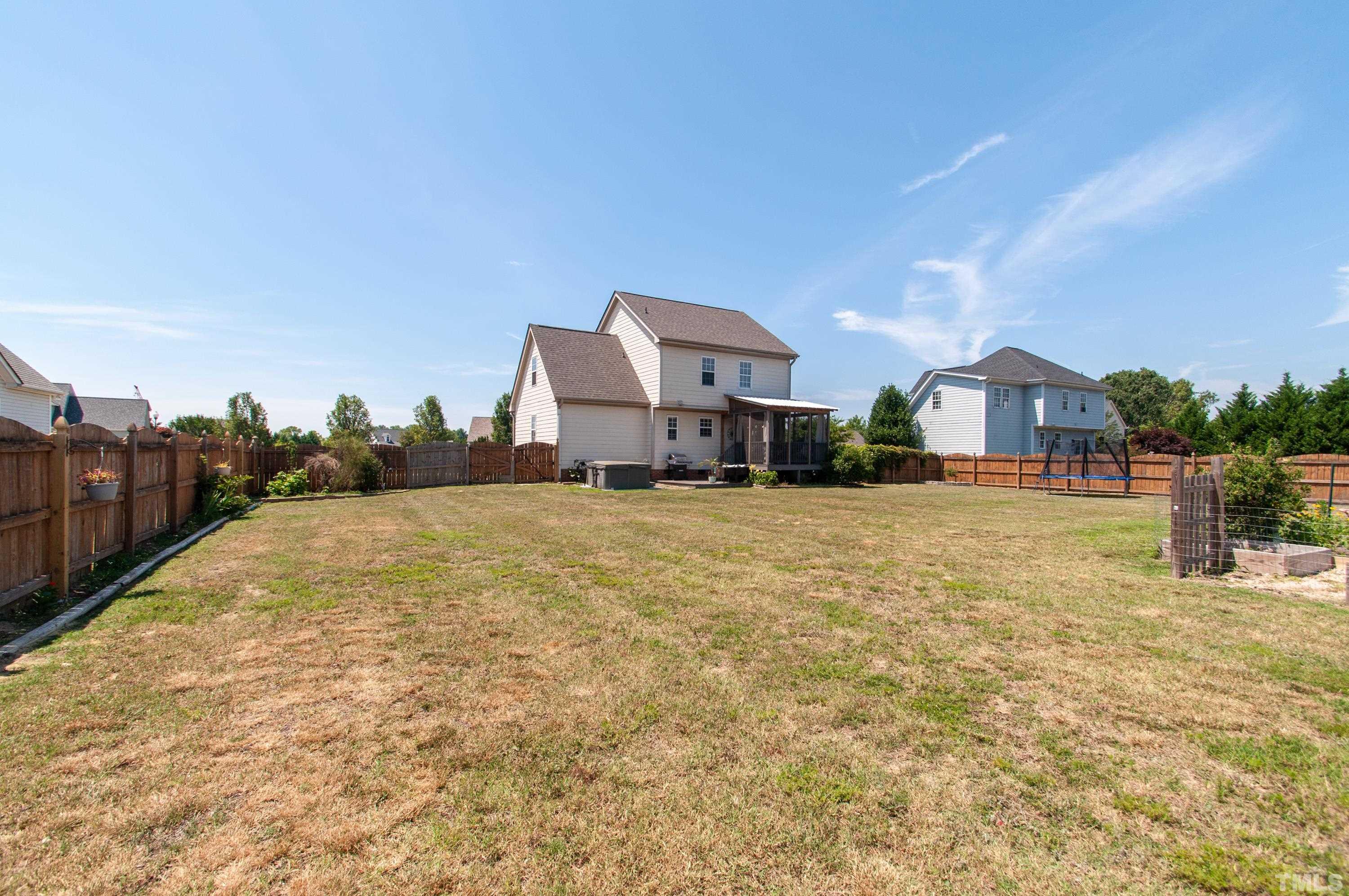4805 Kure Road Raleigh, NC 27603 - Photo 25 of 31 a swimming pool is sitting in front of a house