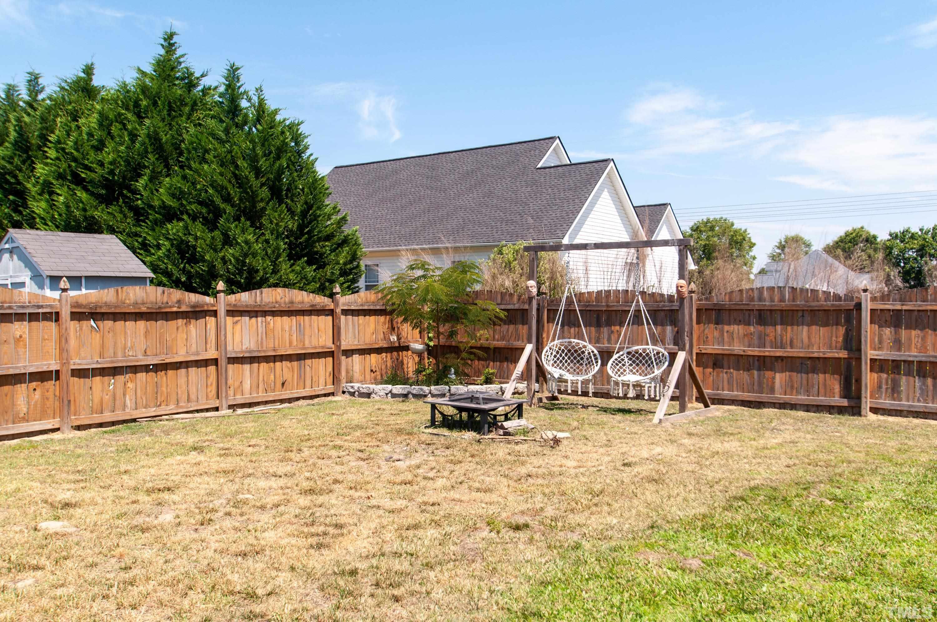 4805 Kure Road Raleigh, NC 27603 - Photo 27 of 31 a view of backyard with small cabin
