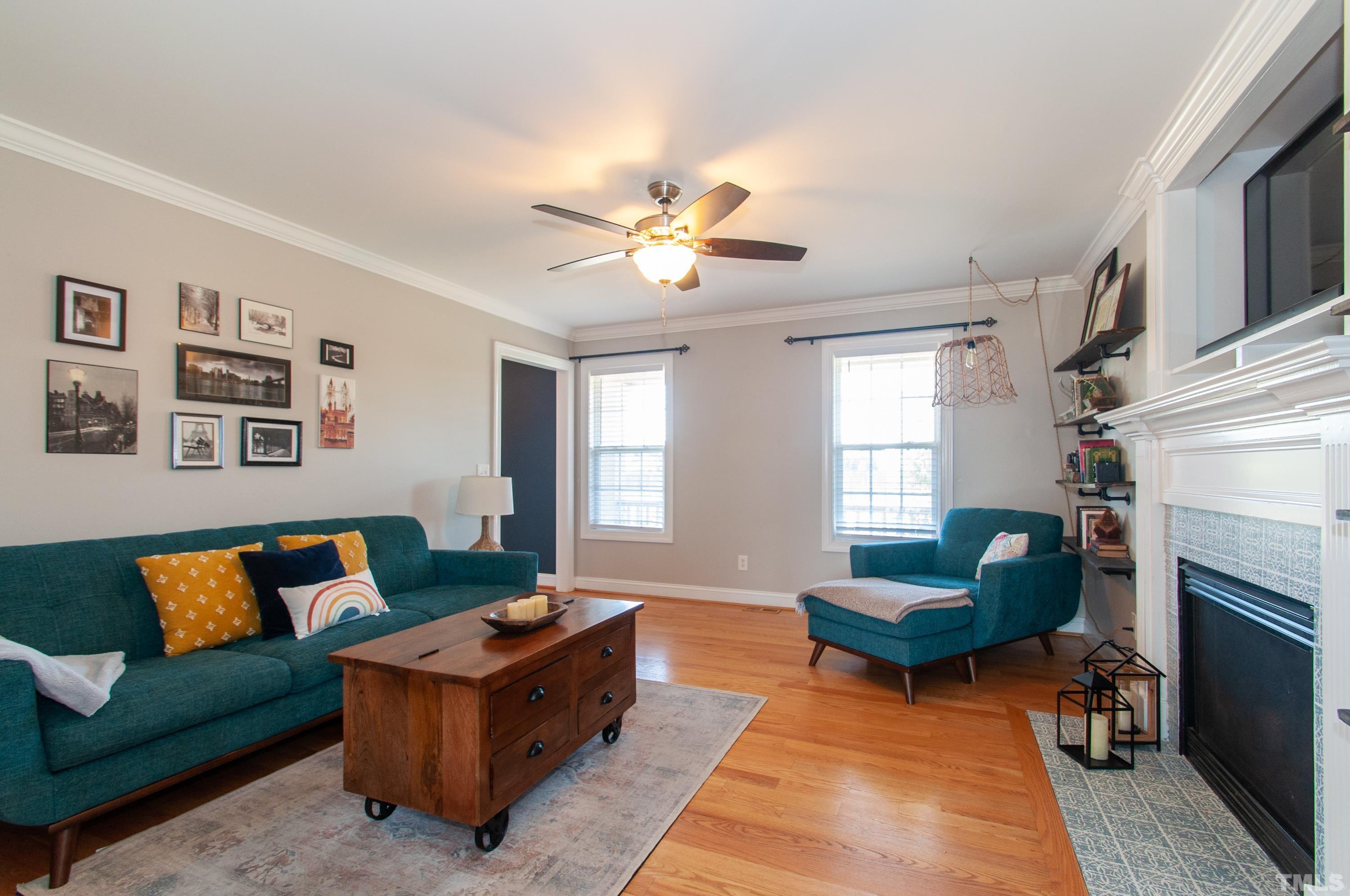 4805 Kure Road Raleigh, NC 27603 - Photo 5 of 31 a living room with furniture and a fireplace