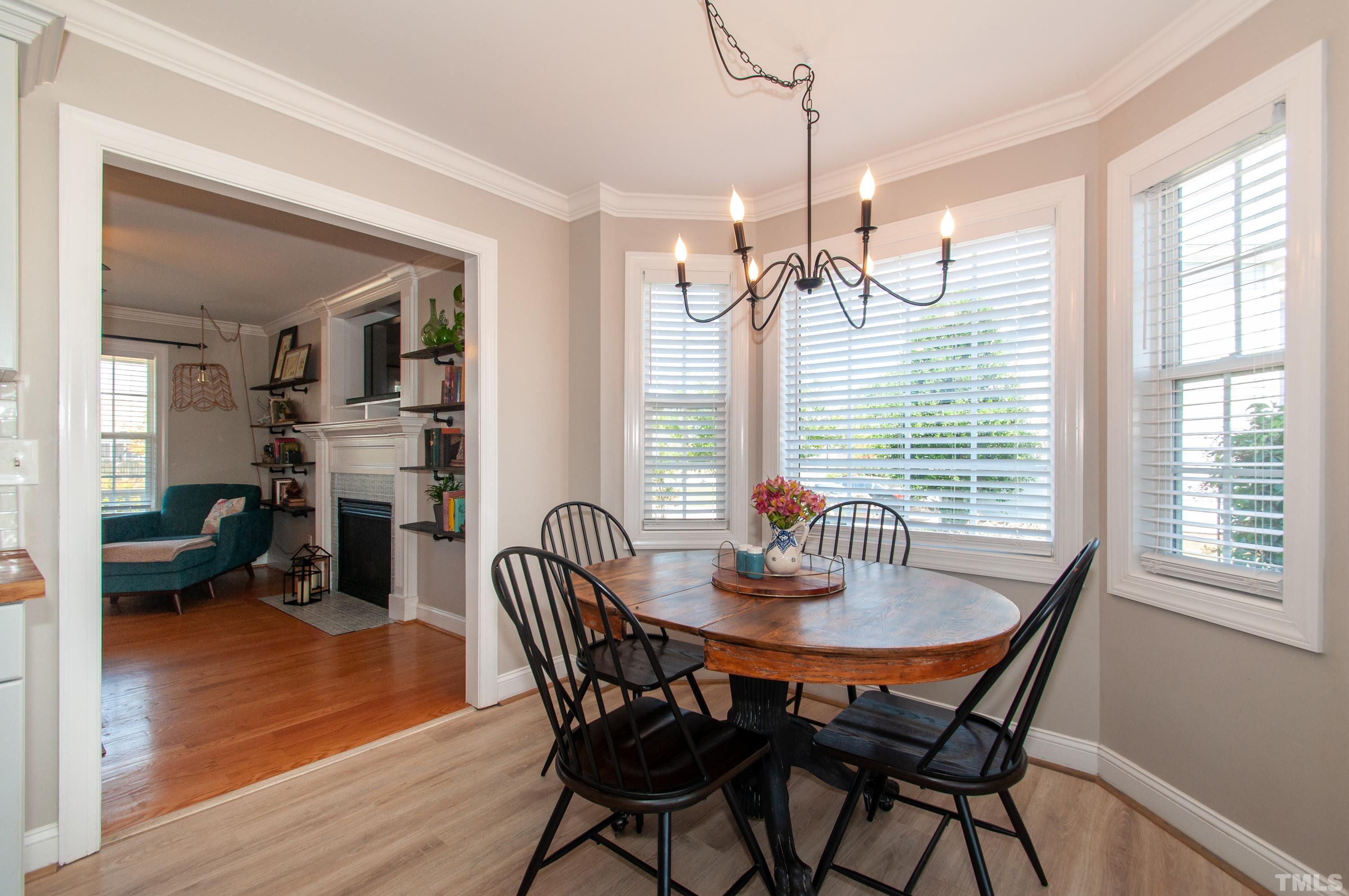 4805 Kure Road Raleigh, NC 27603 - Photo 7 of 31 a dining room with furniture window and wooden floor