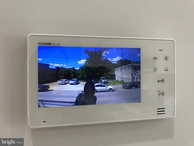 a view of living room with furniture and a fireplace