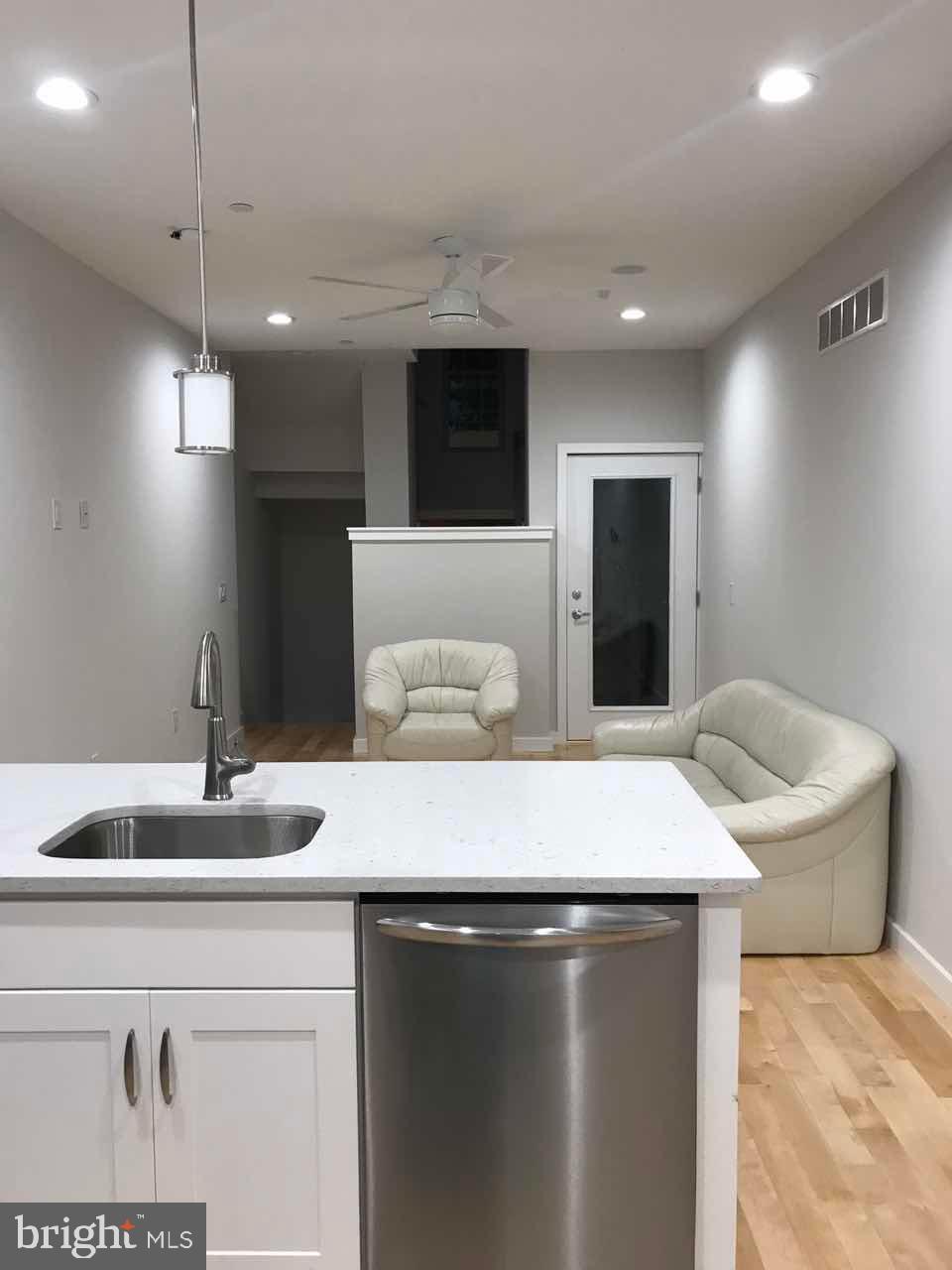 3726 Brandywine Street Philadelphia, PA 19104 - Photo 17 of 18 a kitchen with a sink and a refrigerator