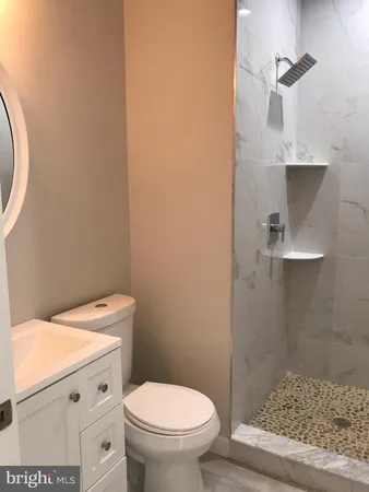 a bathroom with a toilet and a sink