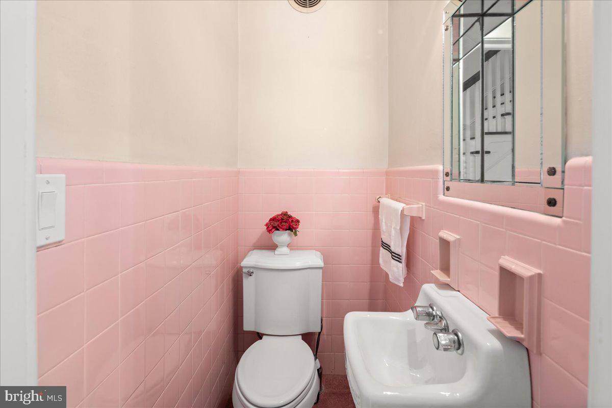 700 River Road Ewing, NJ 08628 - Photo 16 of 71 a white toilet sitting next to a bathroom sink