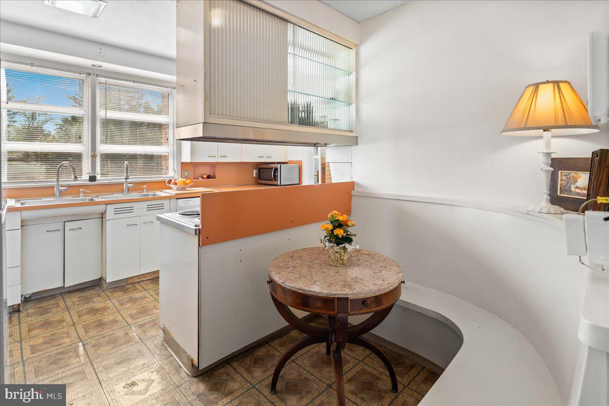 700 River Road Ewing, NJ 08628 - Photo 20 of 71 a kitchen with a sink cabinets and window