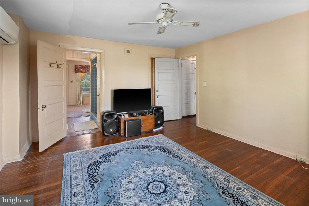 700 River Road Ewing, NJ 08628 - Photo 31 of 71 a living room with furniture and a flat screen tv