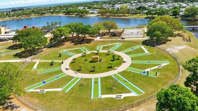 an aerial view of a house with a lake view
