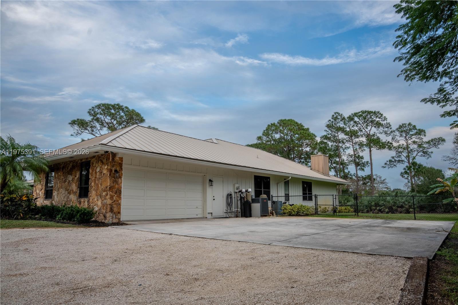 1872 Southeast Colony Way Jupiter, FL 33478 - Photo 6 of 26 front view of a house with a yard