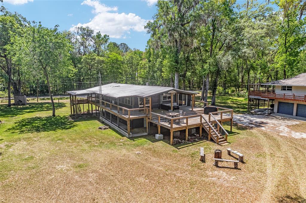 7870 Southwest 25th Place Bell, FL 32619 - Photo 23 of 93 an aerial view of a swimming pool with a yard