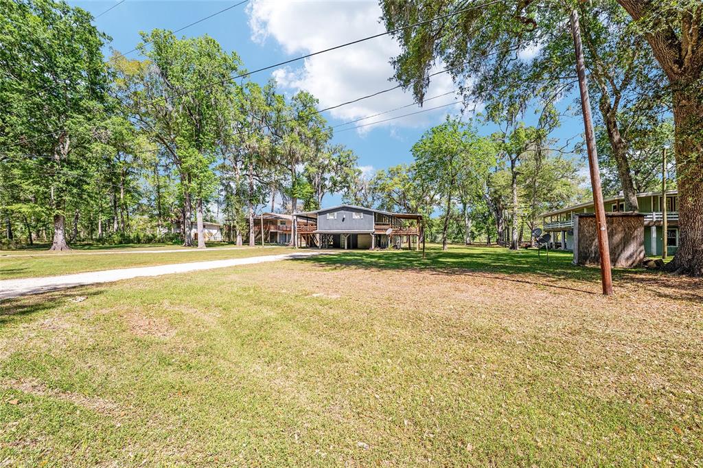 7870 Southwest 25th Place Bell, FL 32619 - Photo 25 of 93 a front view of a house with a yard
