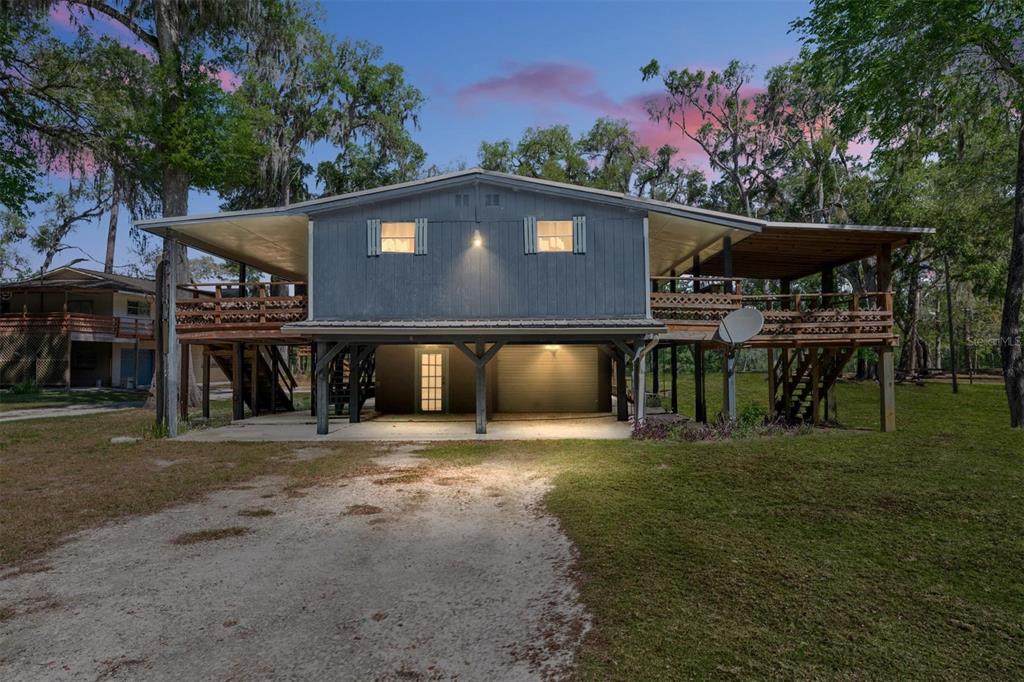 7870 Southwest 25th Place Bell, FL 32619 - Photo 30 of 93 a front view of a house with a yard