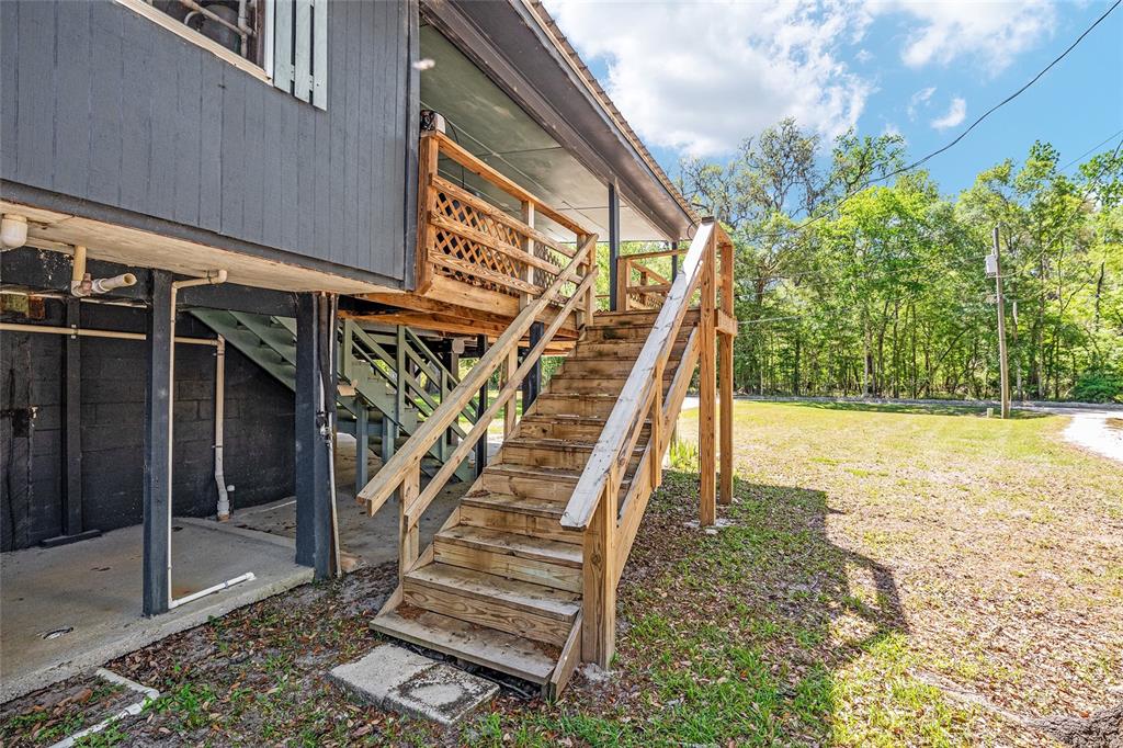 7870 Southwest 25th Place Bell, FL 32619 - Photo 33 of 93 a view of outdoor space deck and floor to ceiling window
