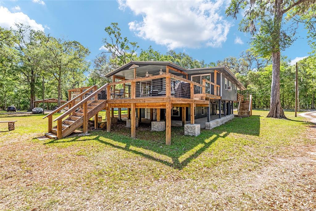 7870 Southwest 25th Place Bell, FL 32619 - Photo 34 of 93 a view of a house with pool and sitting area