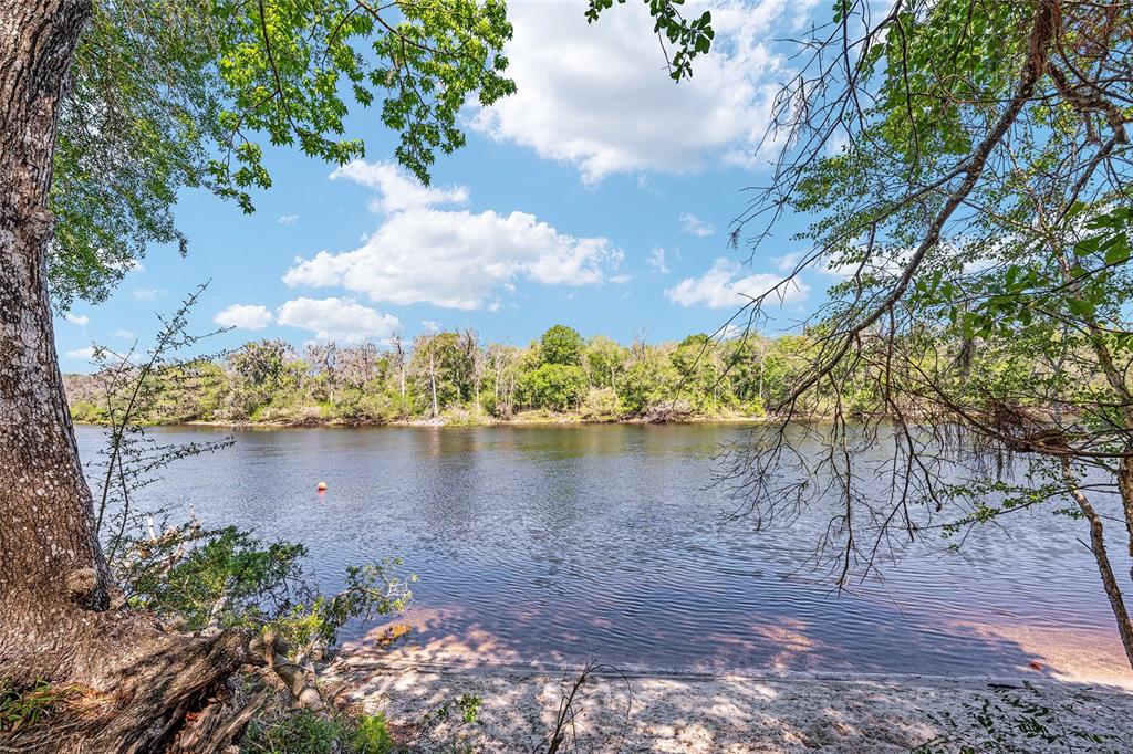 7870 Southwest 25th Place Bell, FL 32619 - Photo 4 of 93 a view of a lake with a yard