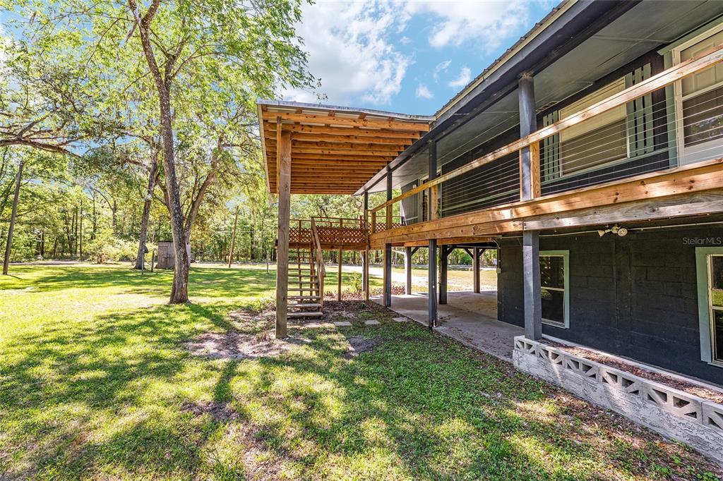 7870 Southwest 25th Place Bell, FL 32619 - Photo 47 of 93 a view of a house with backyard and sitting area