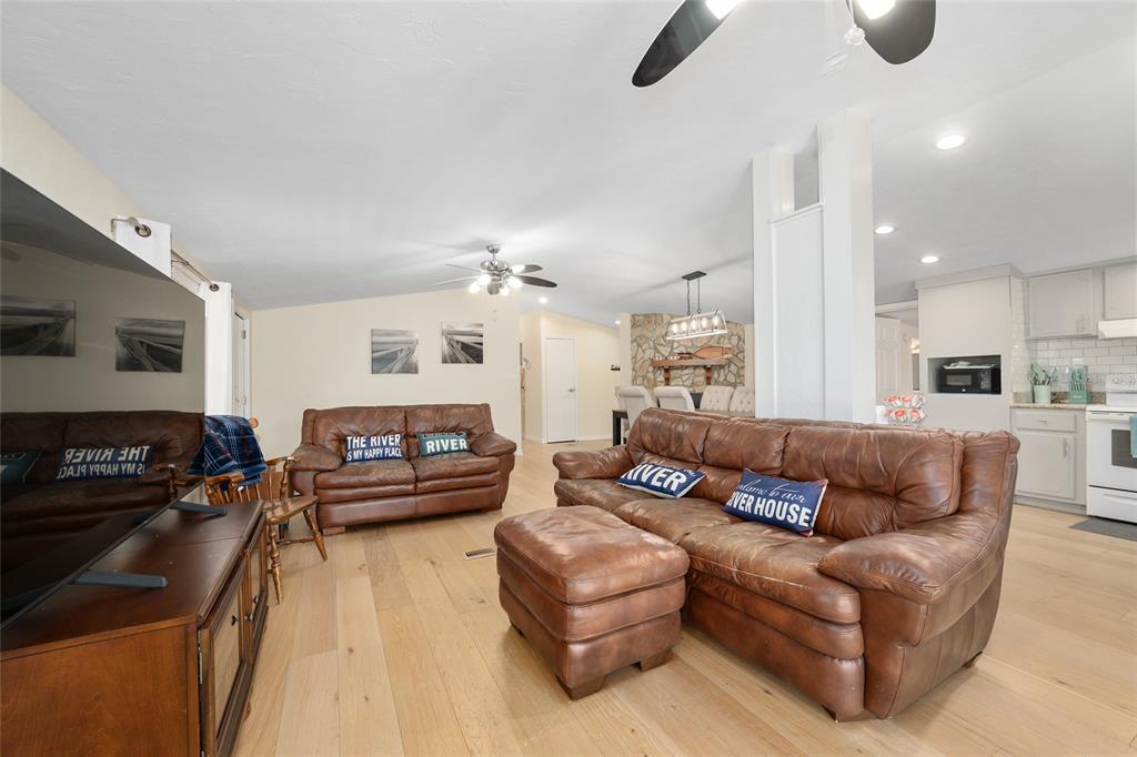 7870 Southwest 25th Place Bell, FL 32619 - Photo 63 of 93 a living room with furniture and a chandelier