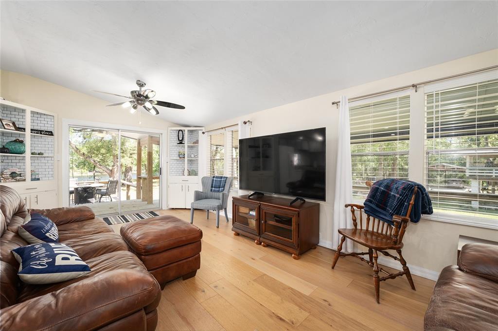 7870 Southwest 25th Place Bell, FL 32619 - Photo 68 of 93 a living room with furniture and a flat screen tv