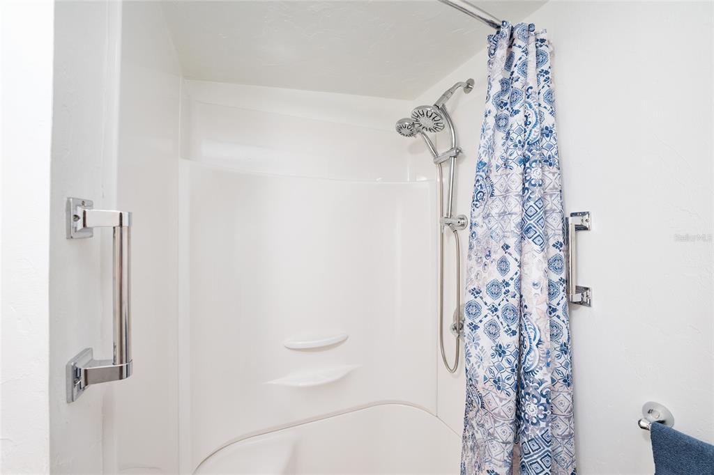 7870 Southwest 25th Place Bell, FL 32619 - Photo 77 of 93 a bathroom with a shower curtain and a shower curtain