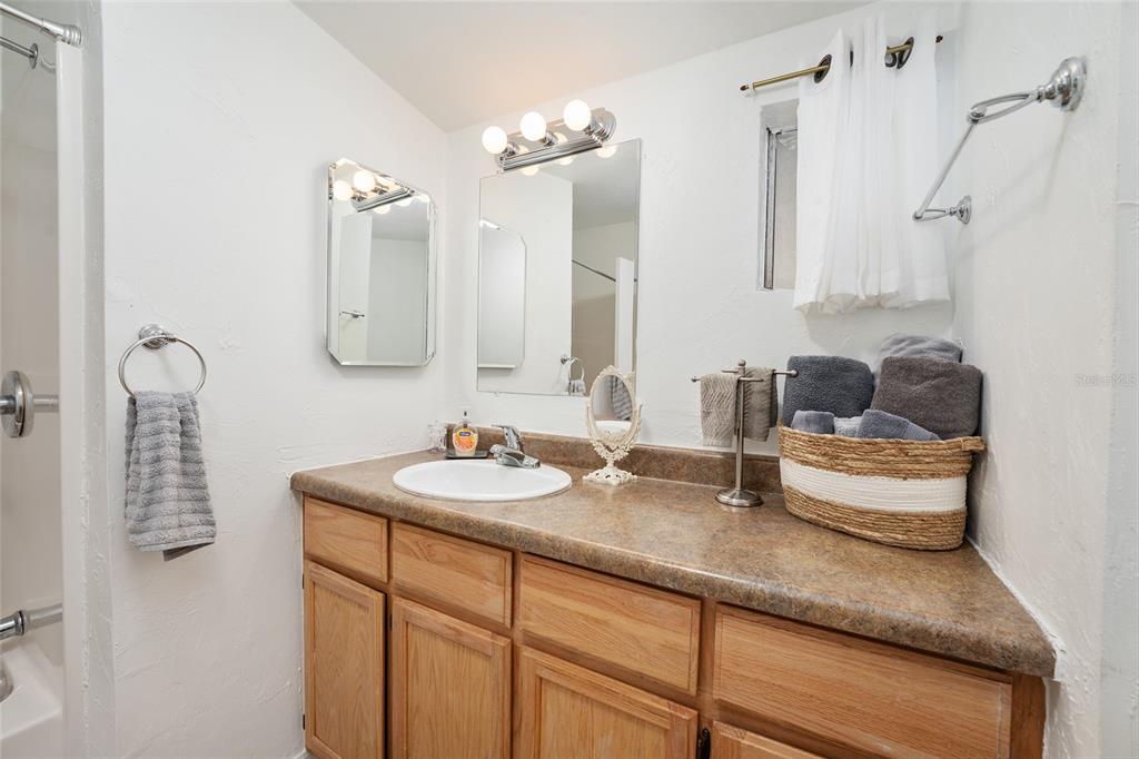 7870 Southwest 25th Place Bell, FL 32619 - Photo 80 of 93 a bathroom with sink and mirror