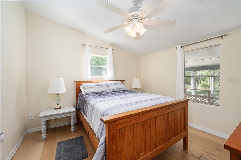 7870 Southwest 25th Place Bell, FL 32619 - Photo 88 of 93 a bedroom with a bed and a table in it