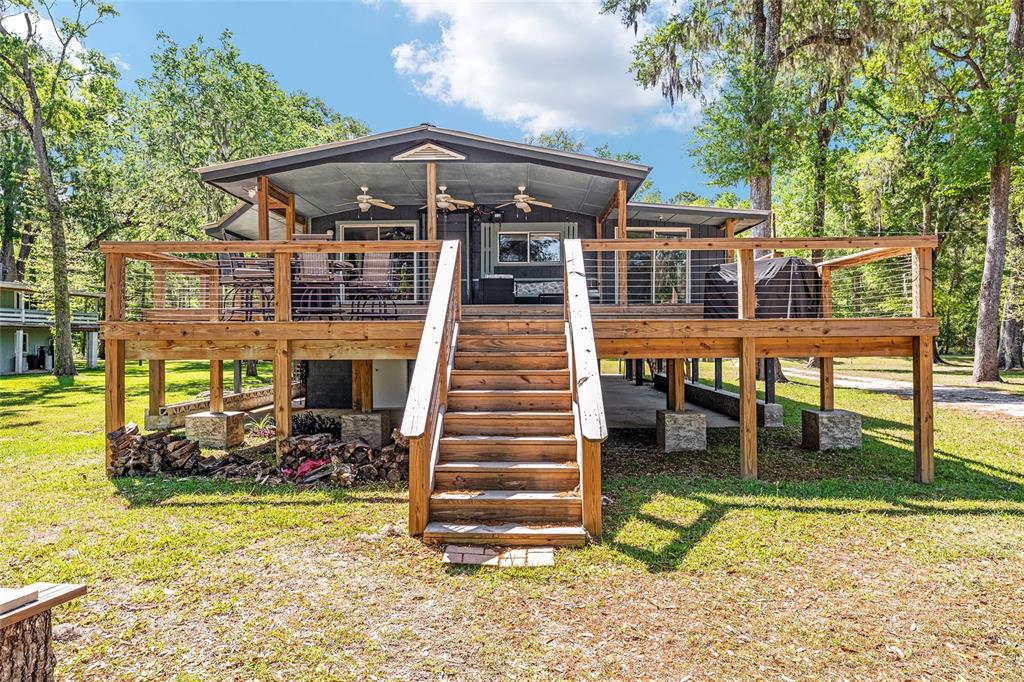 7870 Southwest 25th Place Bell, FL 32619 - Photo 10 of 93 a front view of a house with a yard