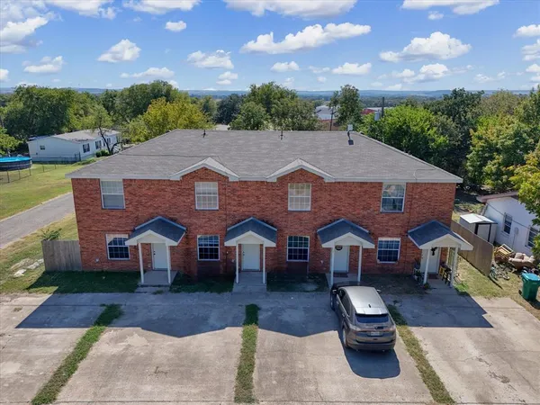 a aerial view of a house with swimming pool and furniture
