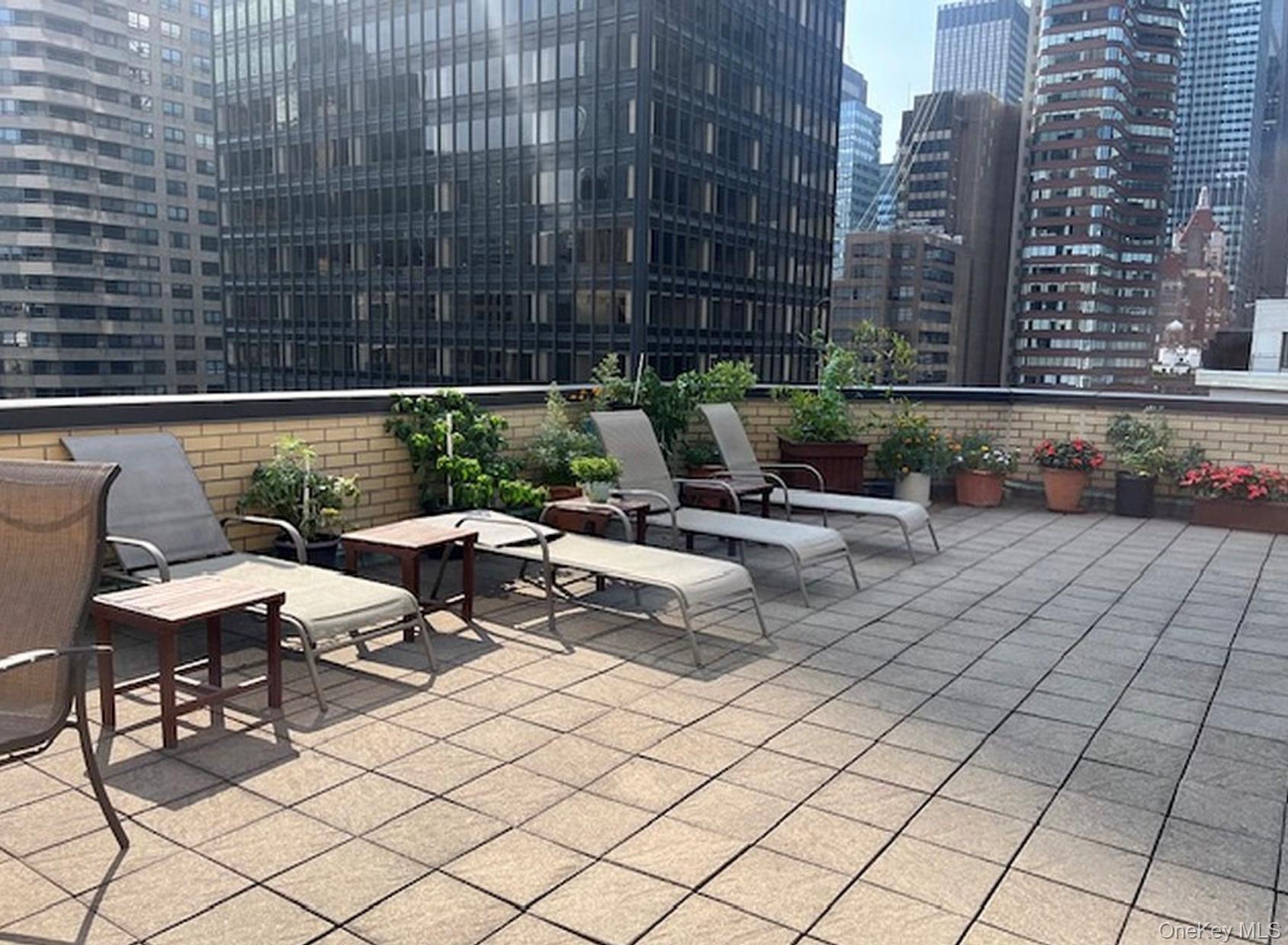 301 East 48th Street, Unit 2C Manhattan, NY 10017 - Photo 21 of 22 a view of a patio with couple of chairs