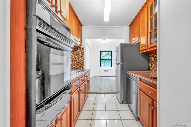a kitchen with a refrigerator a sink and dishwasher