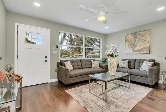 a living room with furniture and a large window