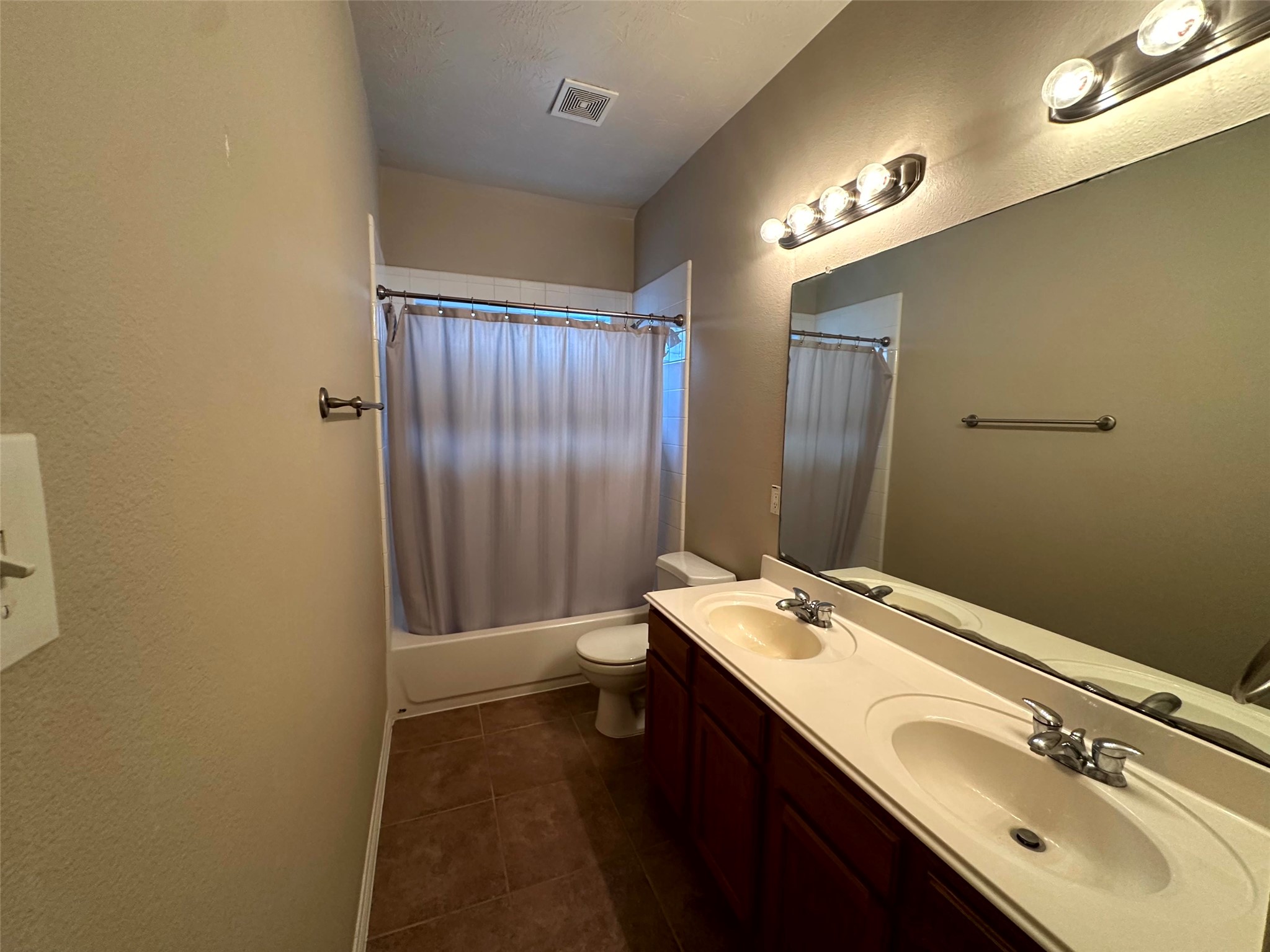 2047 Lulach Lane Conroe, TX 77301 - Photo 13 of 20 a bathroom with a sink and a mirror