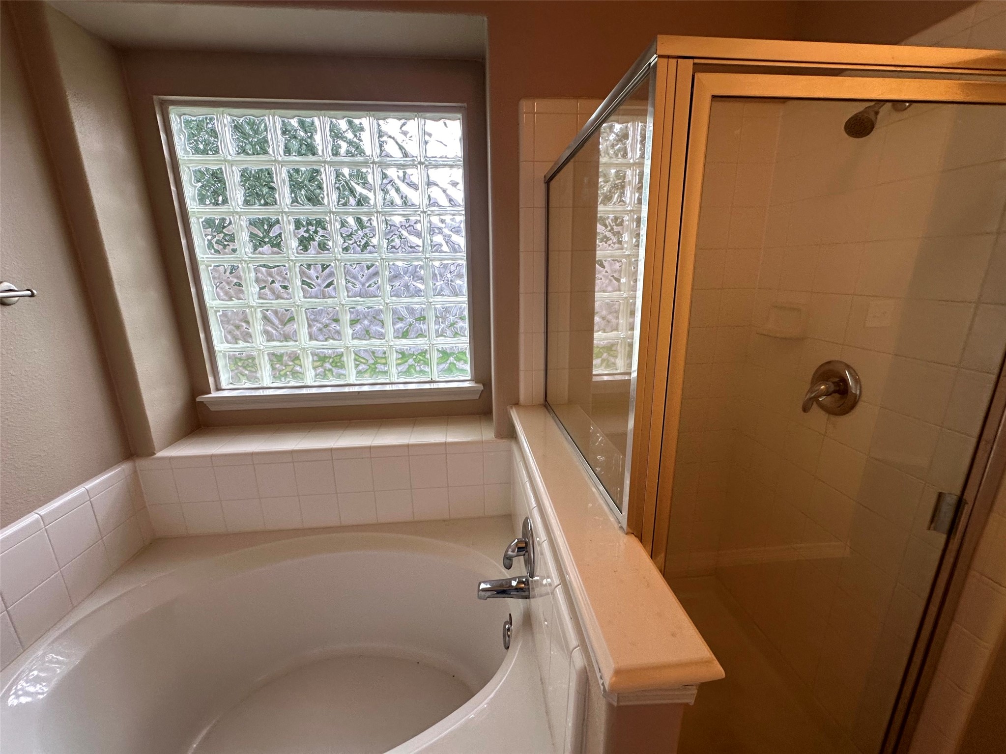2047 Lulach Lane Conroe, TX 77301 - Photo 18 of 20 a bathroom with a bathtub and a shower