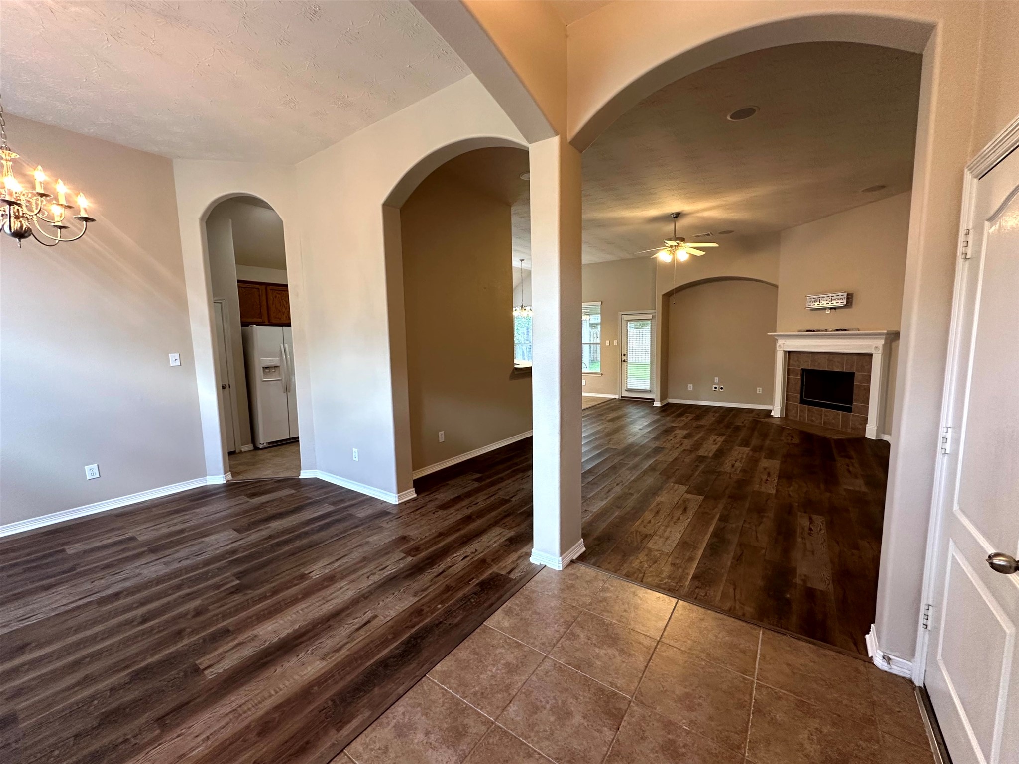 2047 Lulach Lane Conroe, TX 77301 - Photo 2 of 20 a view of a hallway with wooden floor and staircase