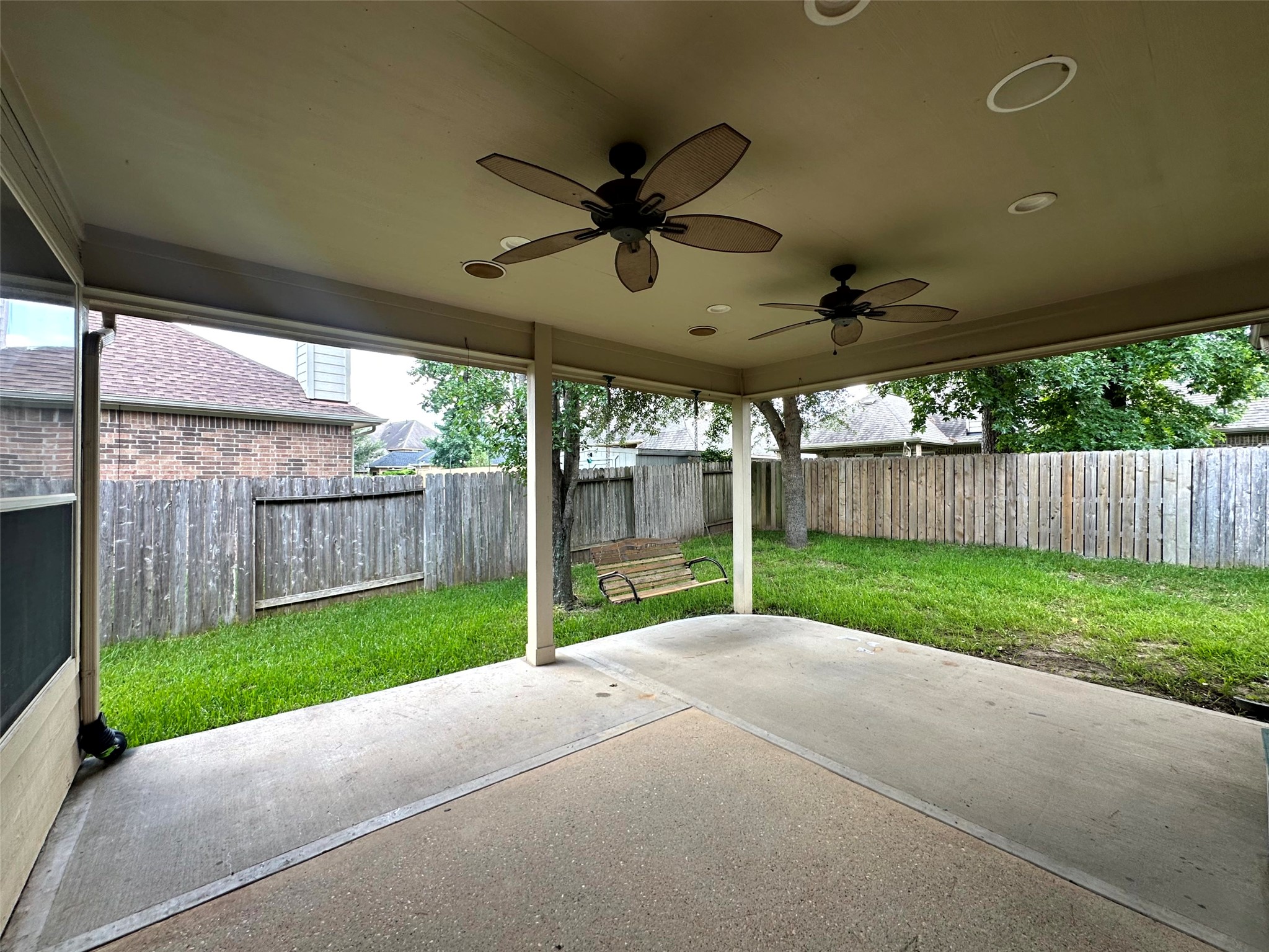 2047 Lulach Lane Conroe, TX 77301 - Photo 9 of 20 a view of a backyard with wooden fence