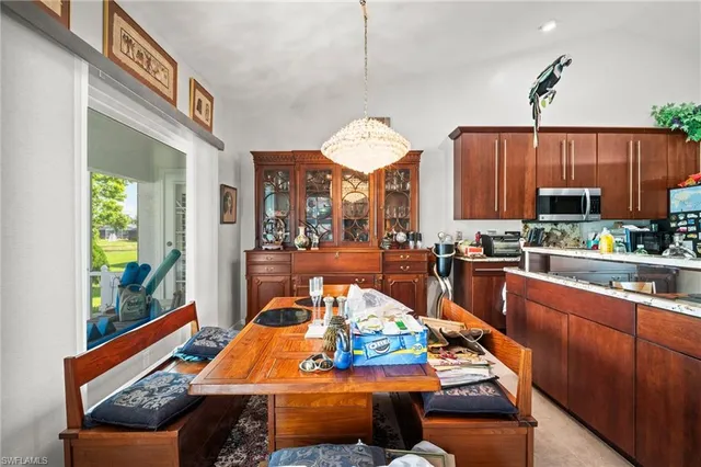 a room with furniture and a kitchen view
