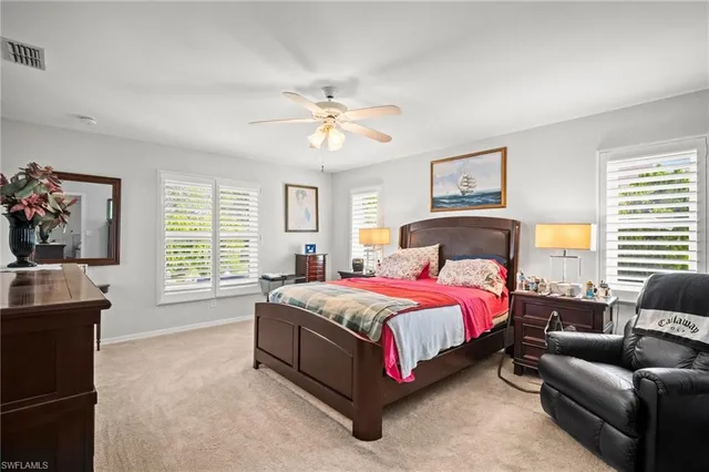 a spacious bedroom with a bed and a couch