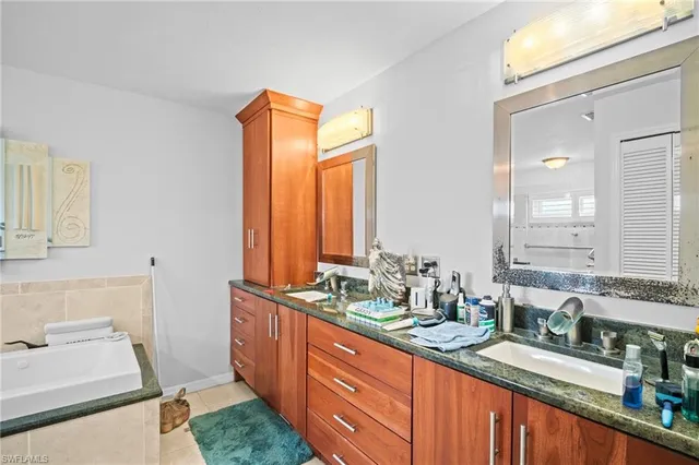 a bathroom with a sink double vanity and a mirror