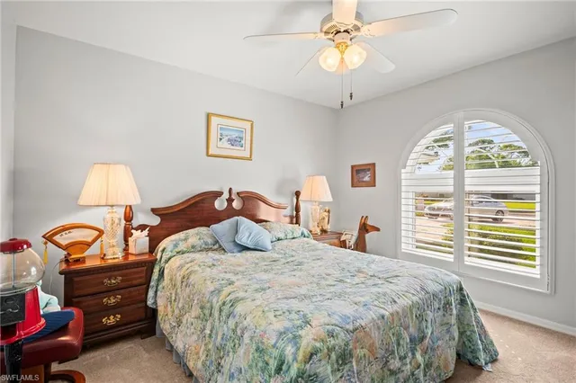 a bed room with a bed and a chandelier