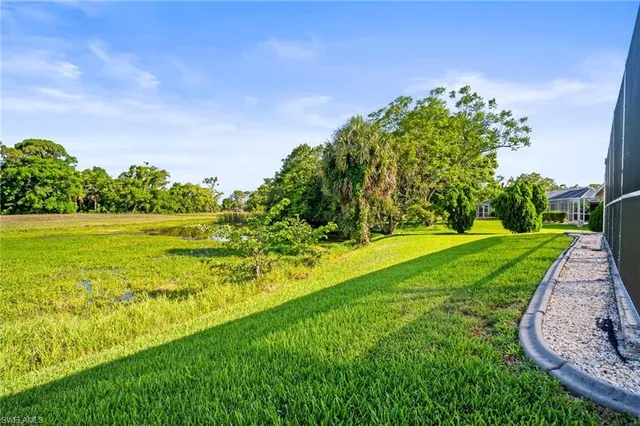 a view of a garden with a building in the background